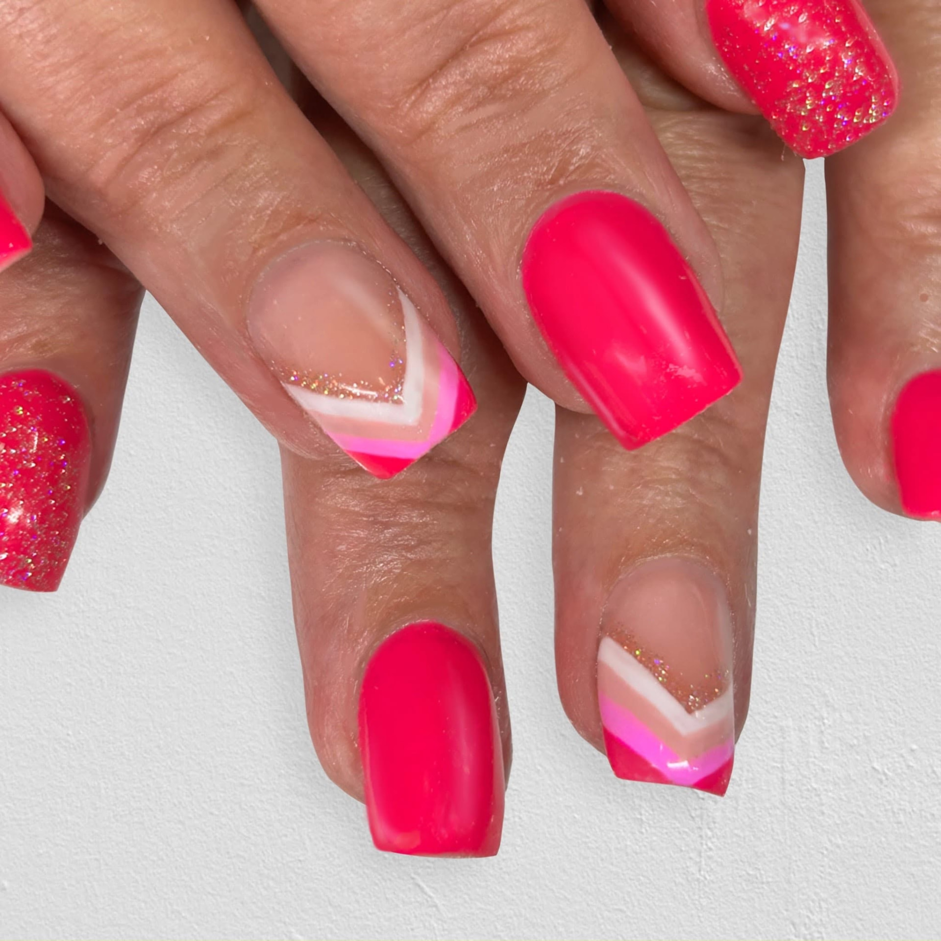 Vibrant pink and glitter nail designs