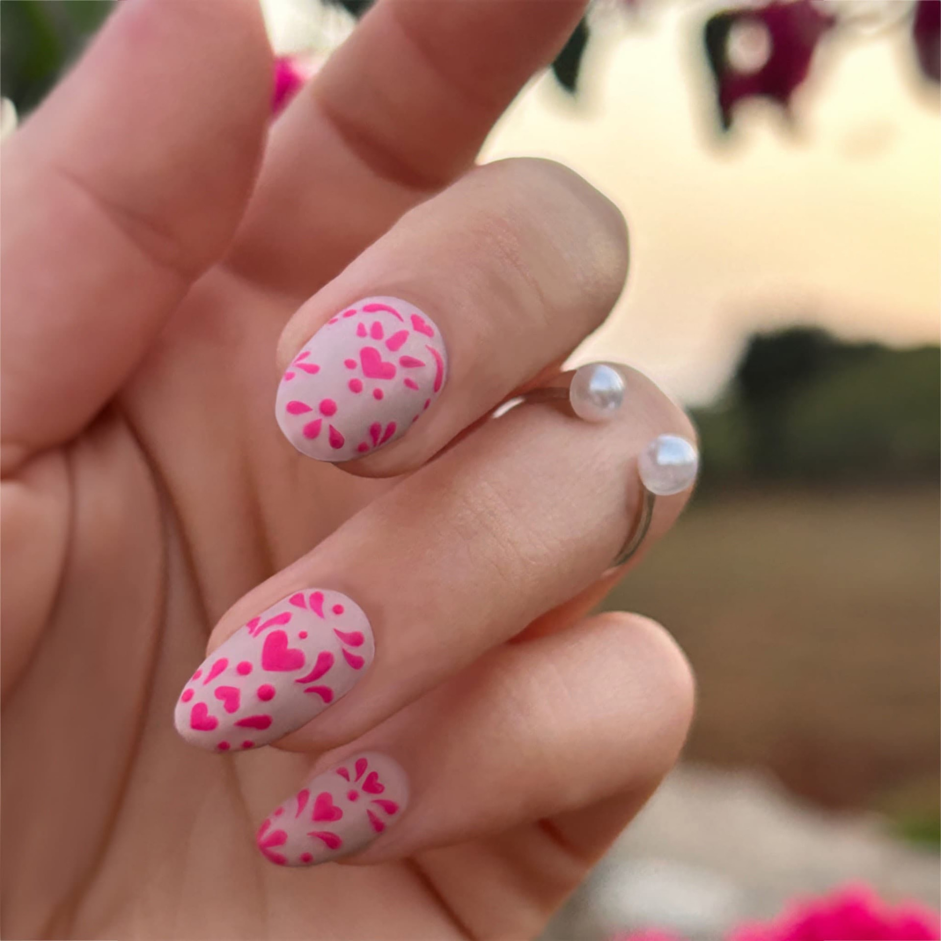 Soft pink hand-painted heart nail art