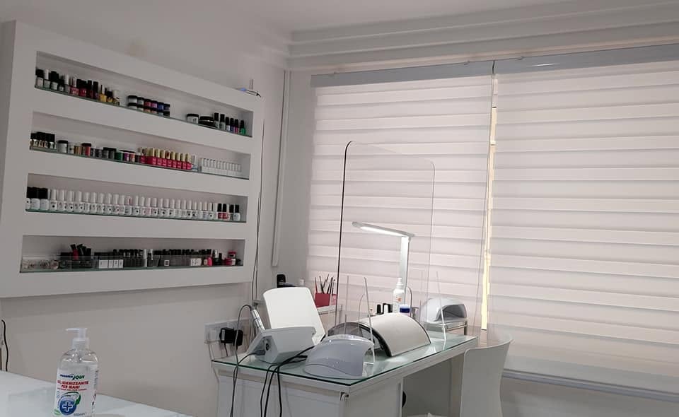 Nail bar with polish shelves inside the salon