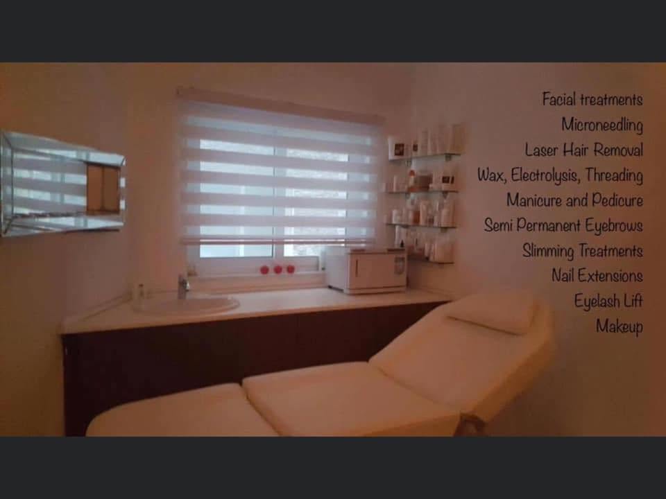 Treatment room with facial bed at the salon